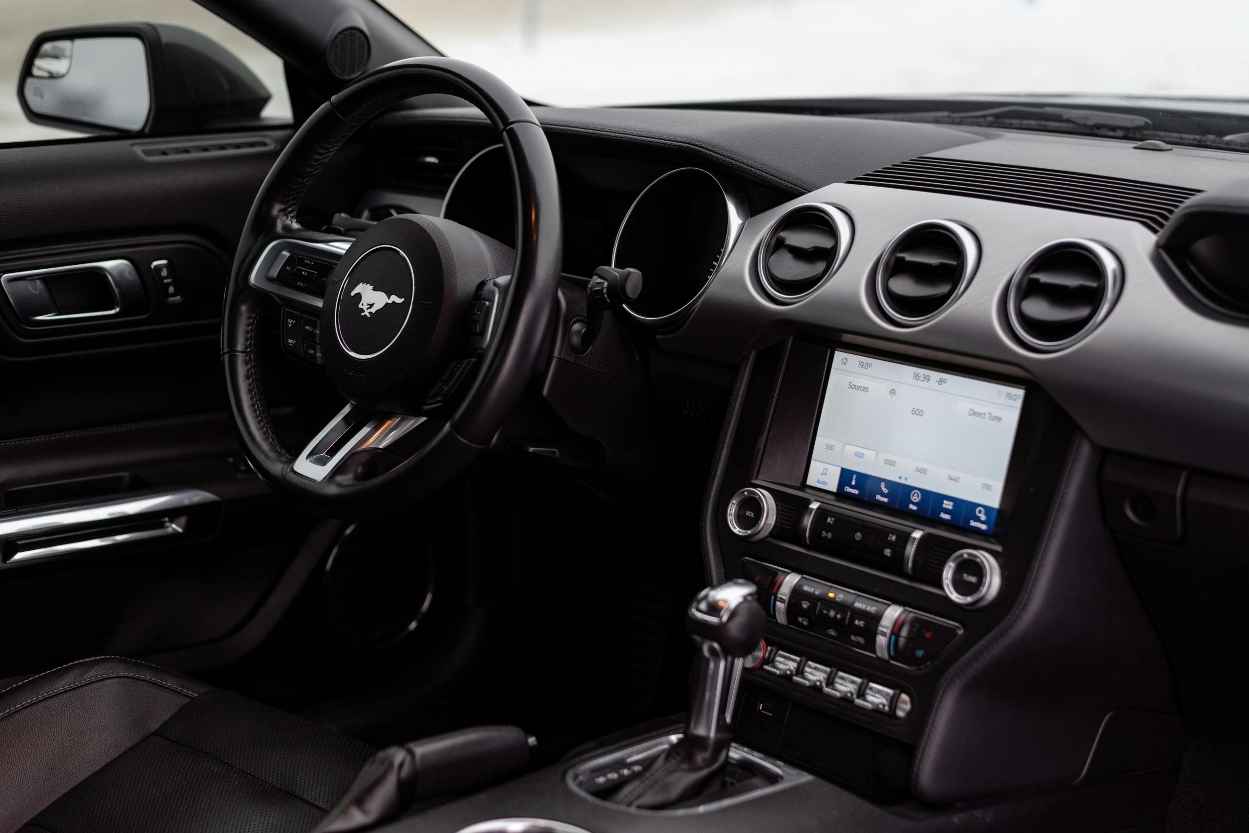 Steering Wheel and Controls of a Ford Mustang Sports Car