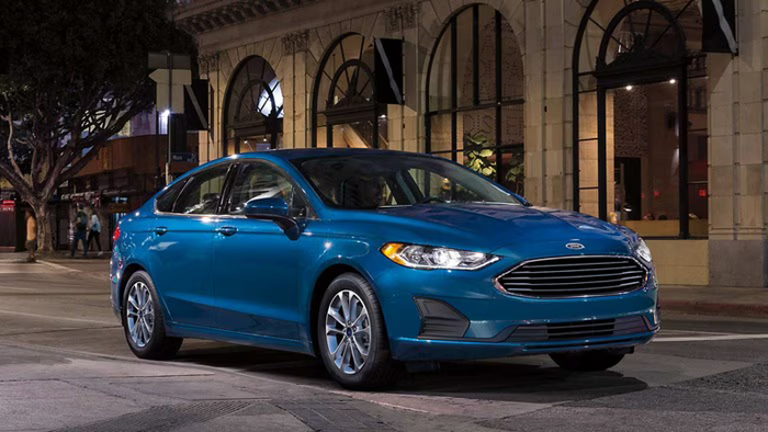 Blue Ford Fusion parked on the rocks