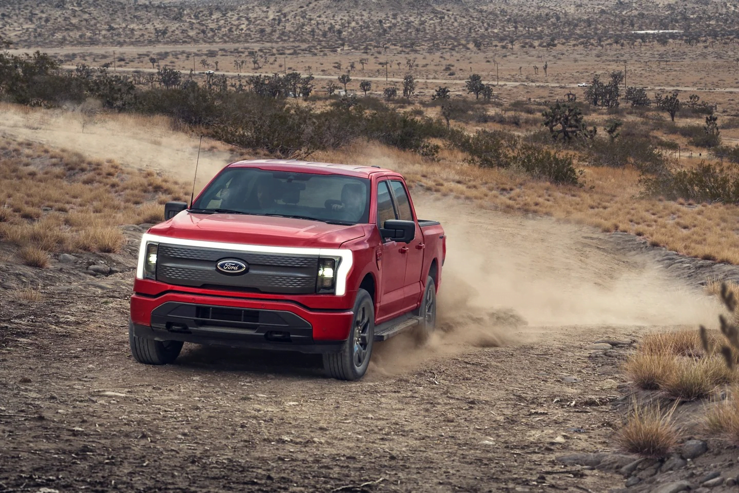 Ford F-150 Lightning driving in dirt