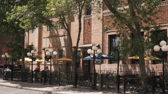 An outdoor cafe as seen on a city street