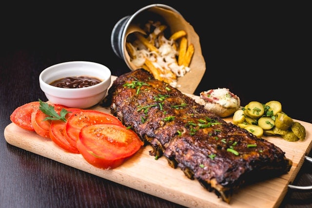 Roasted Ribs with sliced tomatoes and potatoes