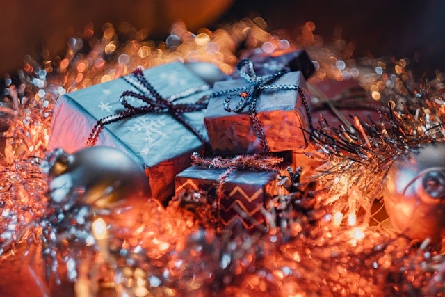 A pile of wrapped presents sitting on top of a table