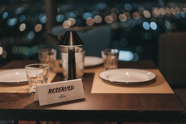 white ceramic plate on a brown wooden table