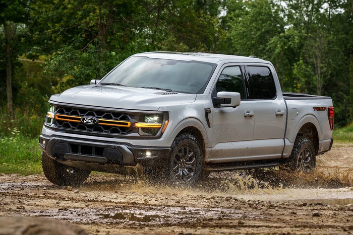 Ford F-150 driving through the mud