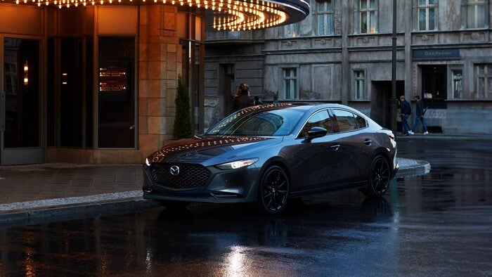 Mazda3 Sedan parked on the side of the road