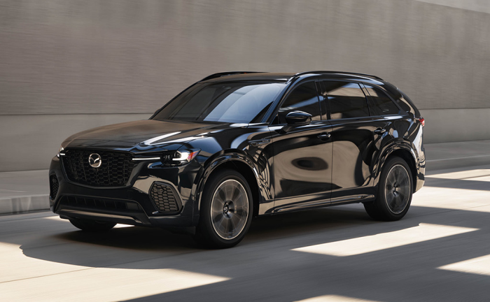 Black Mazda CX-70 driving on the street