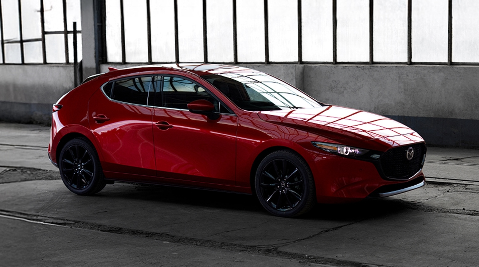 Red 2026 Mazda3 parked in garage