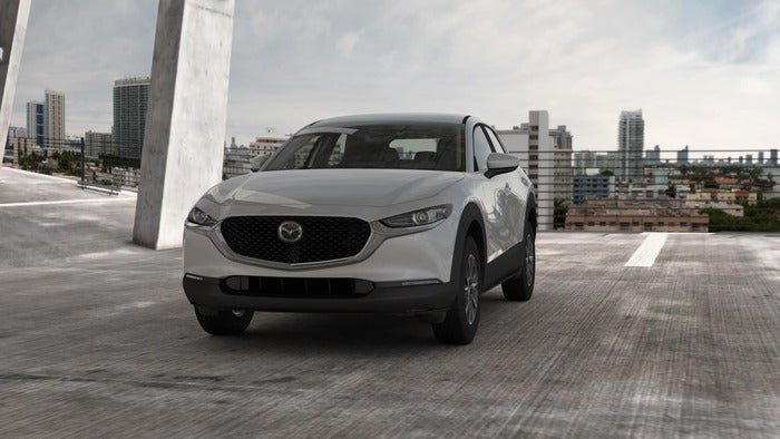 Gray Mazda CX-30 parked in a garage