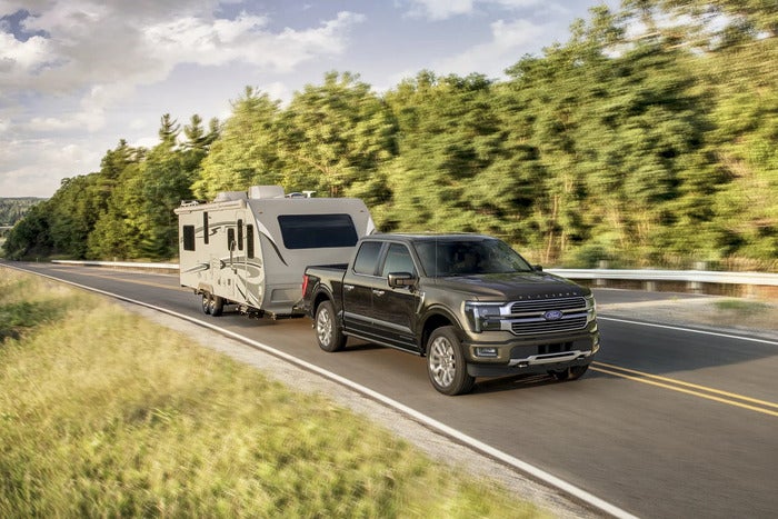 Brown F-150 towing a trailer