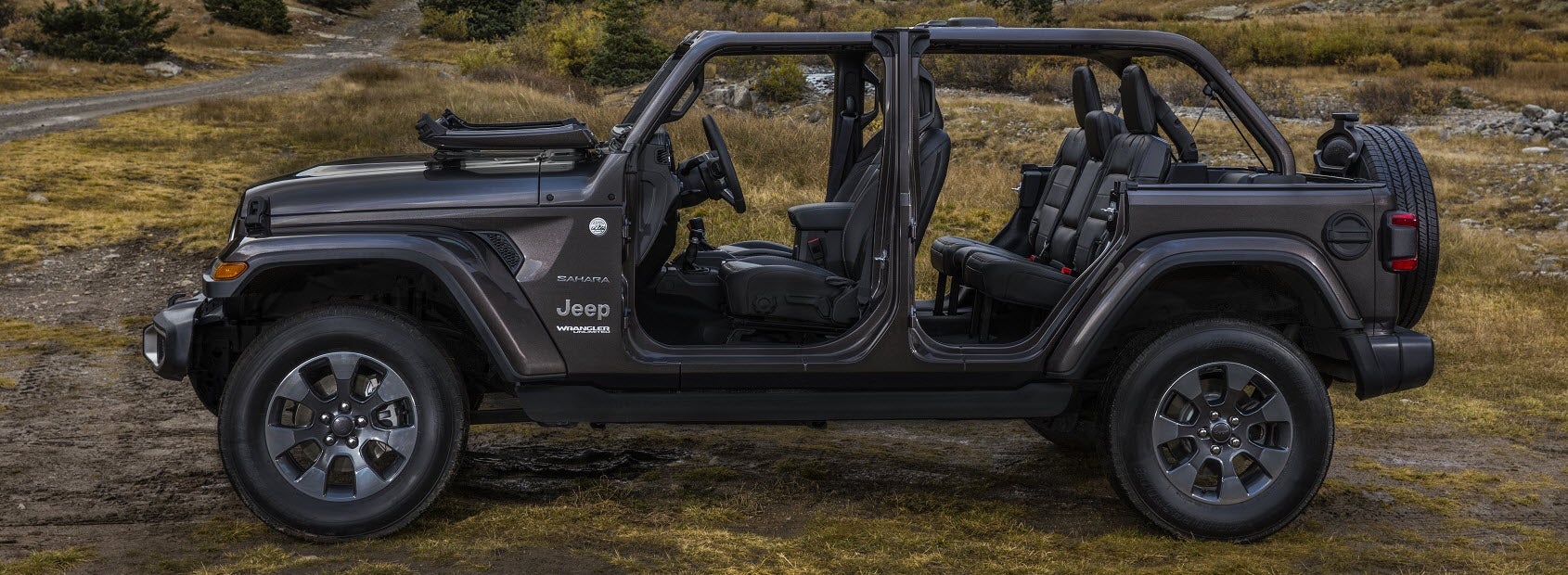 Jeep Wrangler with fold-down windshield and doors removed