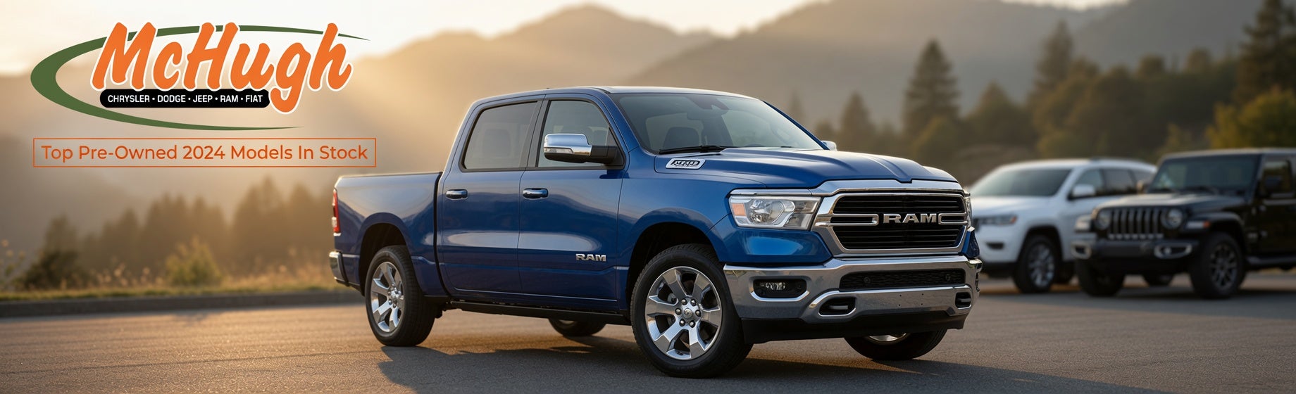 Blue 2024 RAM 1500 Crew Cab pickup truck parked on pavement at golden hour sunset with McHugh Chrysler Dodge Jeep Ram FIAT orange script logo in upper left corner and orange text box reading “Top Pre-Owned 2024 Models In Stock.” Warm sunlight creates reflections on the blue metallic paint, chrome grille, and wheels. Blurred background shows rolling hills, trees, and other vehicles at McHugh CDJR dealership in Zanesville, Ohio.