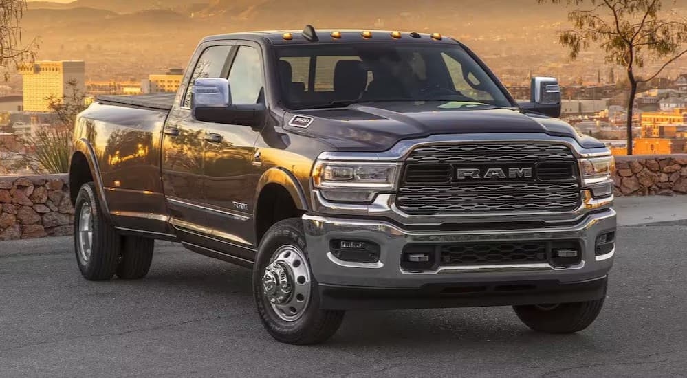 A black 2024 Ram 3500 parked after viewing a used Ram for sale.