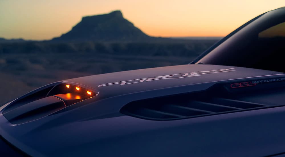 Close-up of the hood of a 2021 Ram 1500 TRX at dusk.
