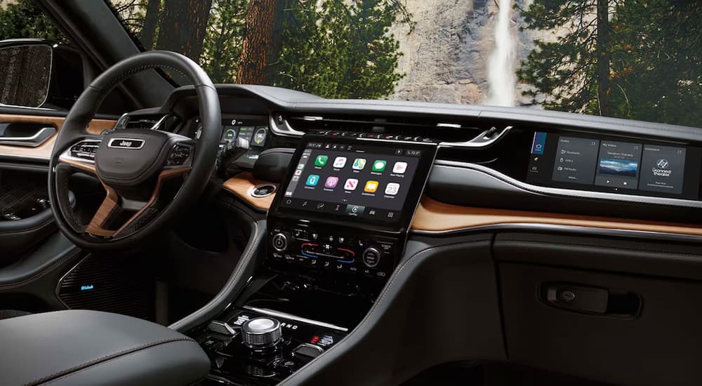 The large infotainment screen in the cabin of a 2024 used Jeep Grand Cherokee for sale.