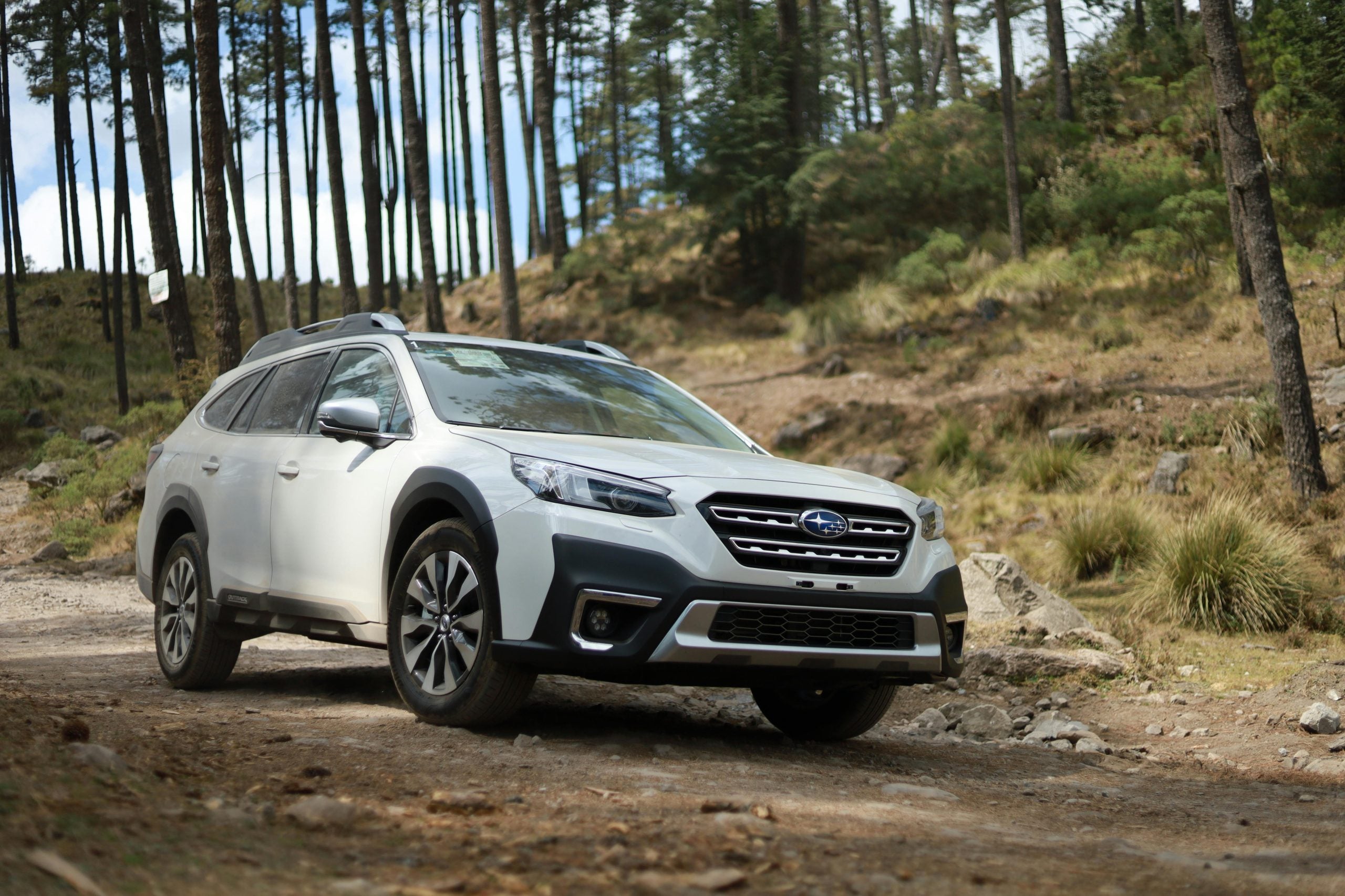 A Subaru Outback on a dirt road