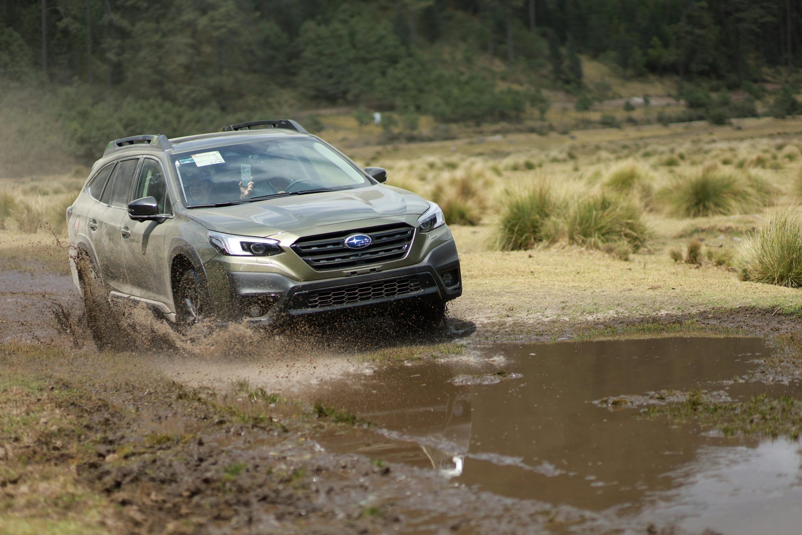 Car Driving in Puddle