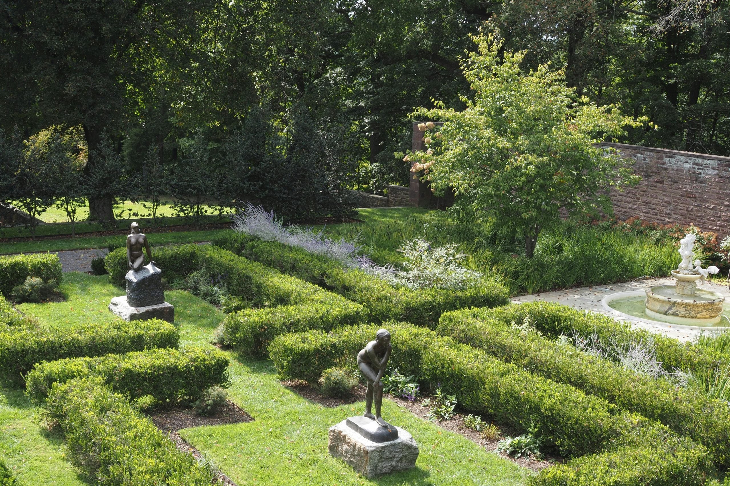 Statues and Plants in Garden