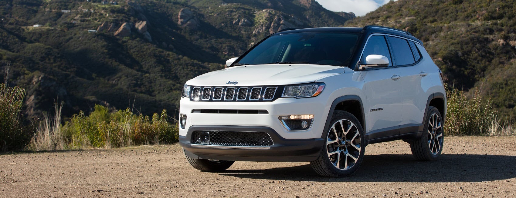 Jeep Compass on dirt road