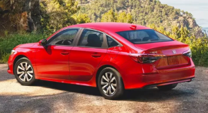 A red 2024 Honda Civic Sedan parked outdoors near Indianapolis, Indiana