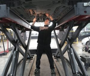 Person working on a car near Indianapolis, IN