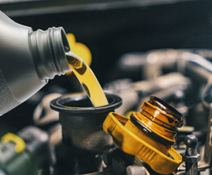 An oil change being performed in a car near Indianapolis, Indiana