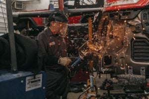 Mechanic fixing a car after a collision near Indianapolis, IN