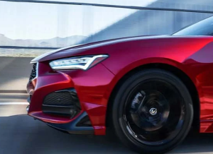 The front end of a 2023 Acura TLX, driving near Indianapolis, Indiana