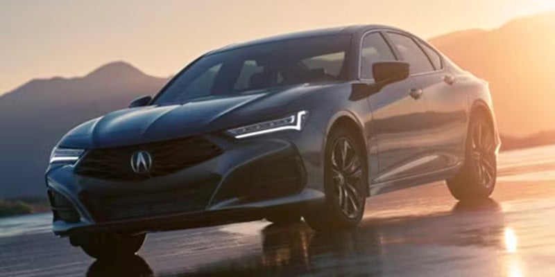 Front view of a 2025 Acura TLX parked in an outdoor setting, highlighting sleek design and trim features at Ed Martin Acura in Indianapolis, IN.