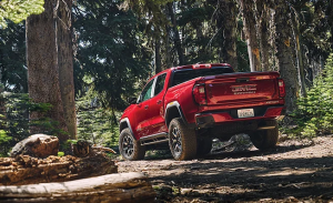 A GMC Canyon parked at a campsite in a forest near Carmel, Indiana