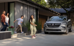 A family leaving their house to get into their 2024 Buick Enclave parked in the driveway near Carmel, Indiana