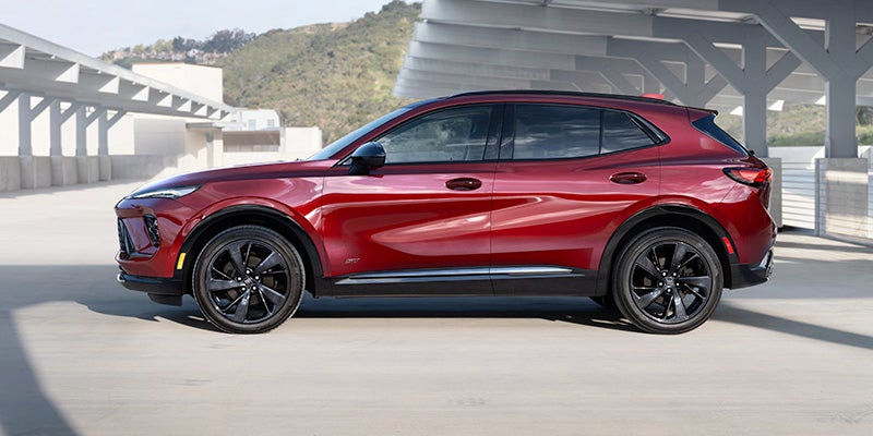 A dark red 2025 Buick Envision parked on the roof of a parking structure near Carmel, IN