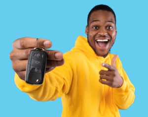 A person holding the keys to their new pickup truck purchased near Fishers, Indiana