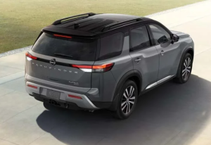 A 2024 Nissan Pathfinder driving down a road near Fishers, Indiana