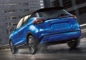 2023 Nissan Kicks driving on a wet road near Indianapolis, Indiana