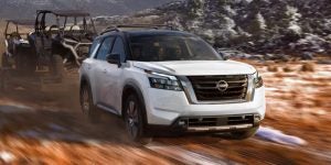 2025 2025 Nissan Pathfinder off-roading on a snow road. showcasing it's diversity