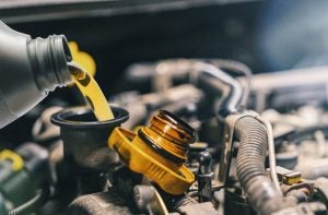 An oil change being performed at an auto service center near Indianapolis, Indiana.