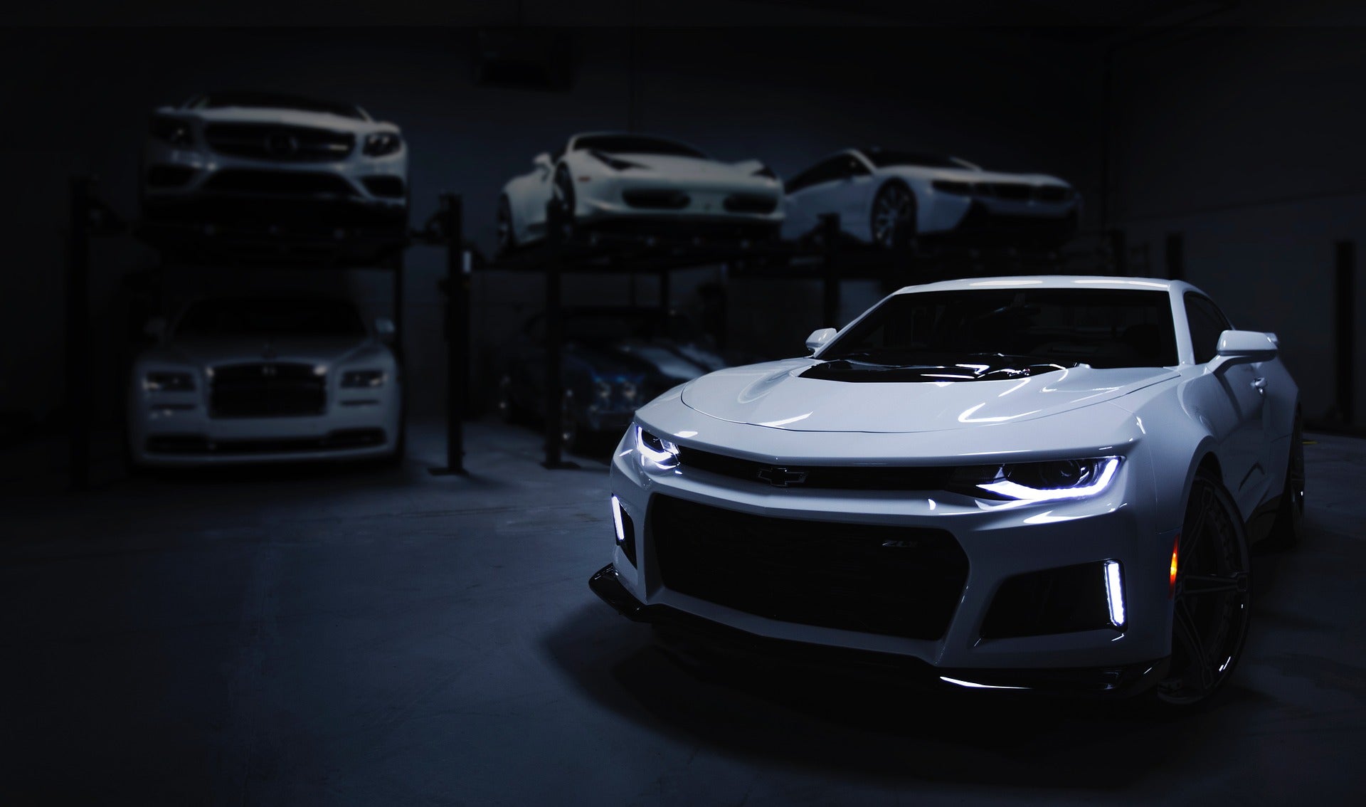 A Chevy Camaro in a garage