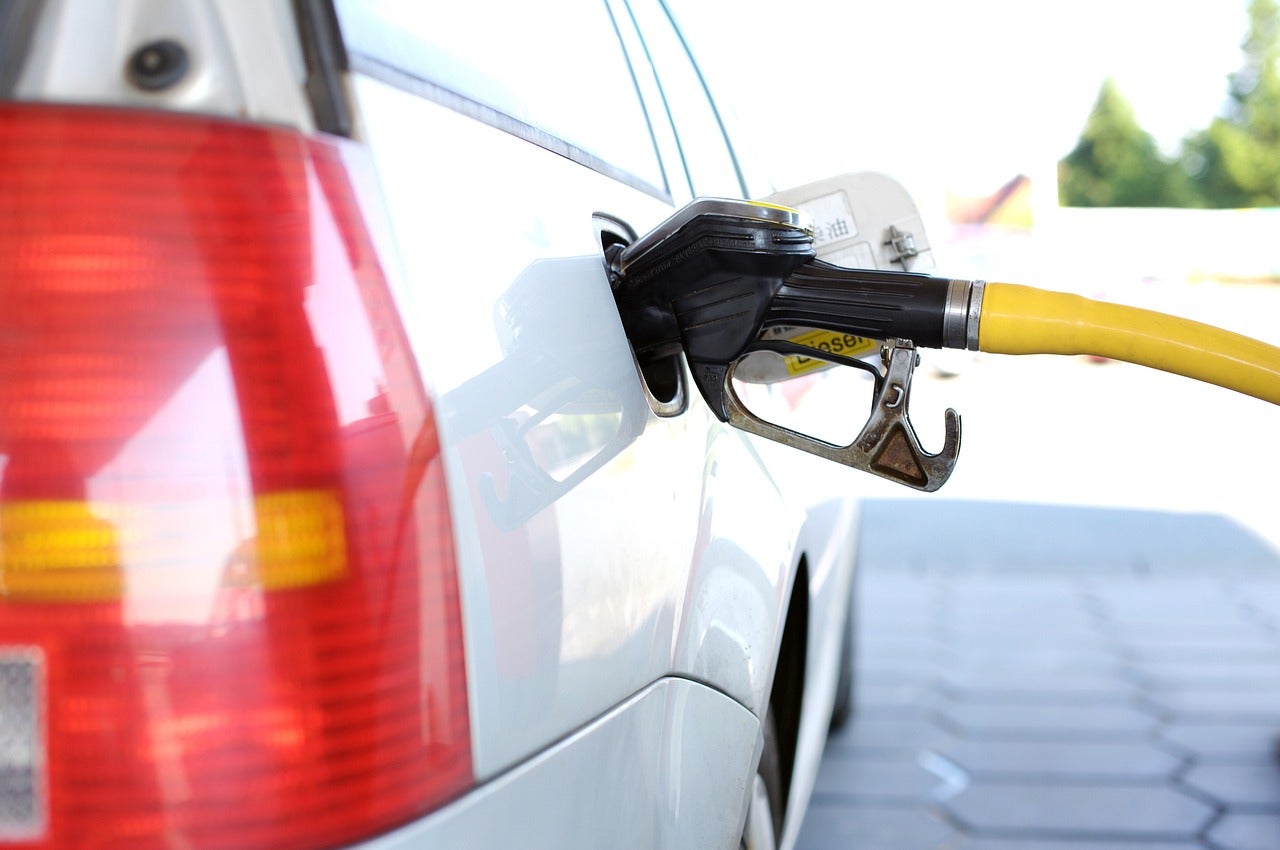 A car being filled with fuel