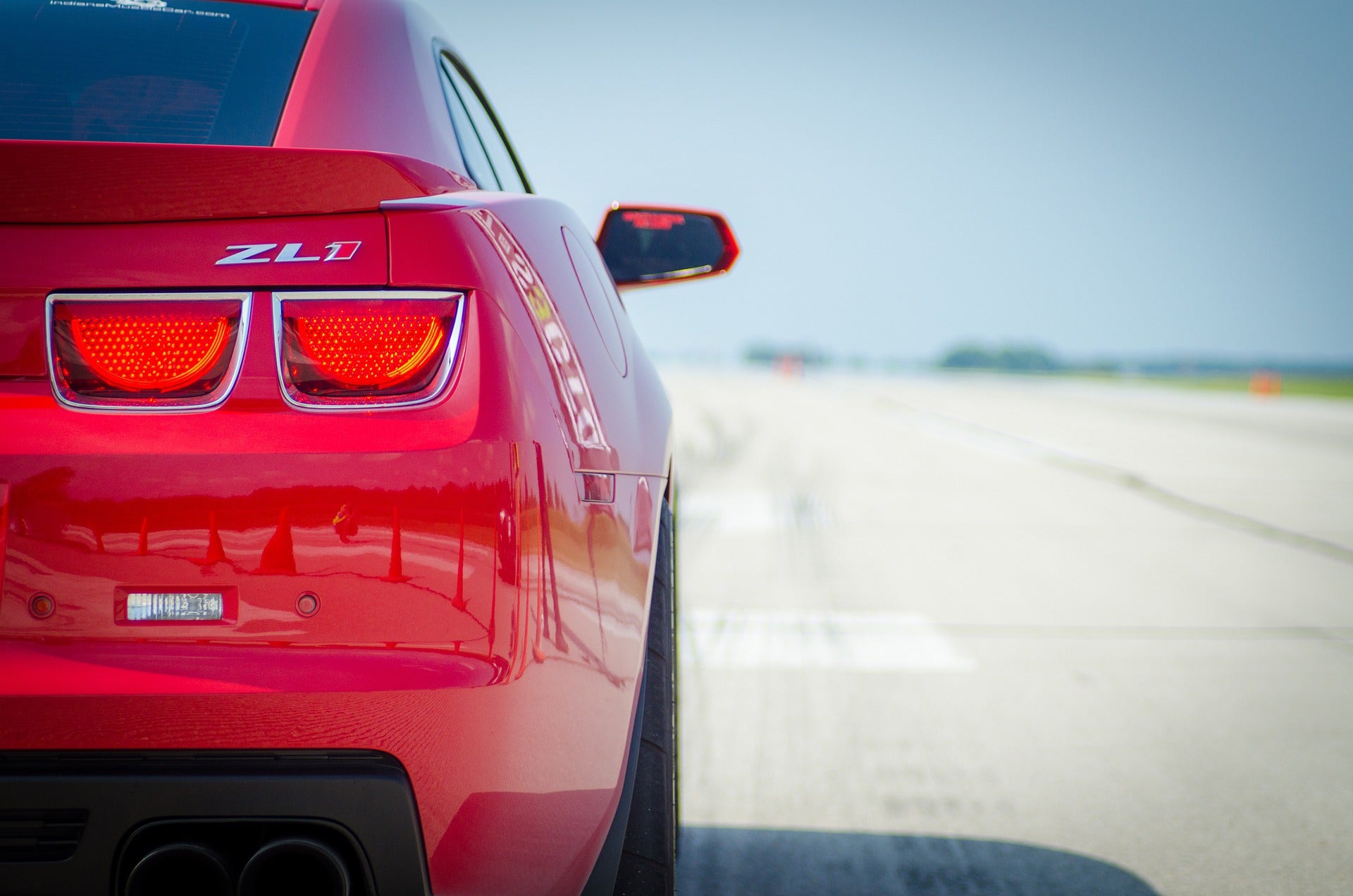 The back of a red Chevy Camaro