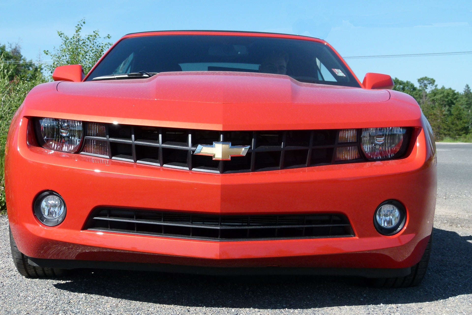 The front of a red Chevy Camaro