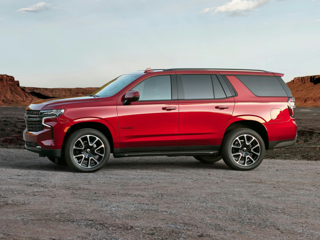 A red Chevy Tahoe parked outside