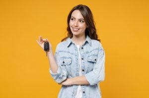 A person holding a set of car keys after buying a car near Indianapolis, Indiana