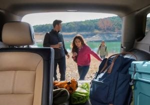 An interior view of a 2024 Chevy Equinox, looking out the back hatch at a family. Taken near Anderson, IN
