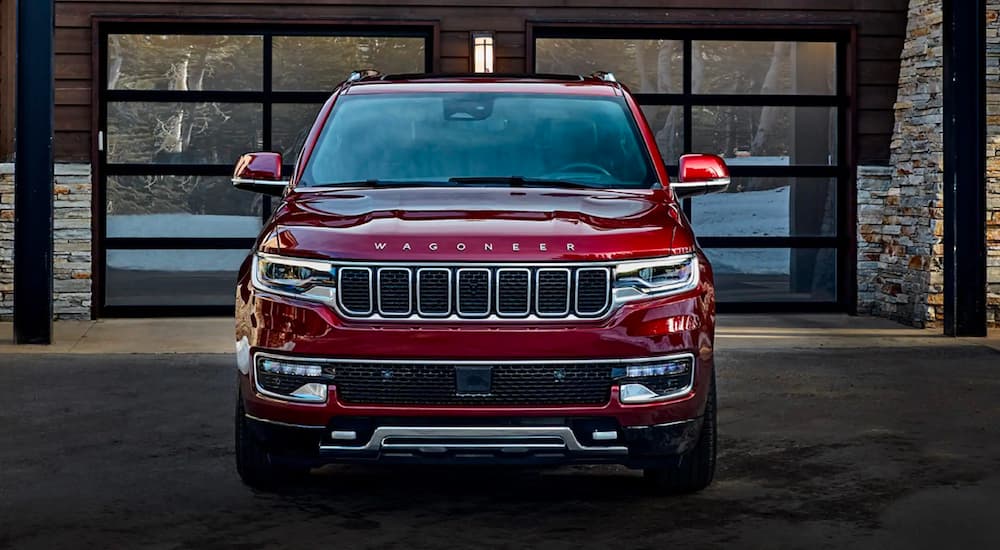 A red 2022 Wagoneer parked in a driveway.