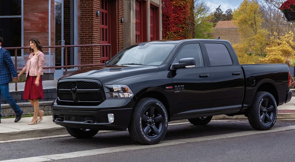 A black 2022 Ram 1500 Classic parked on the side of a New Jersey city street