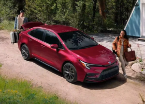 A 2023 Toyota Corolla Hybrid parked outdoors on a dirt road of a campground near Anderson, Indiana.