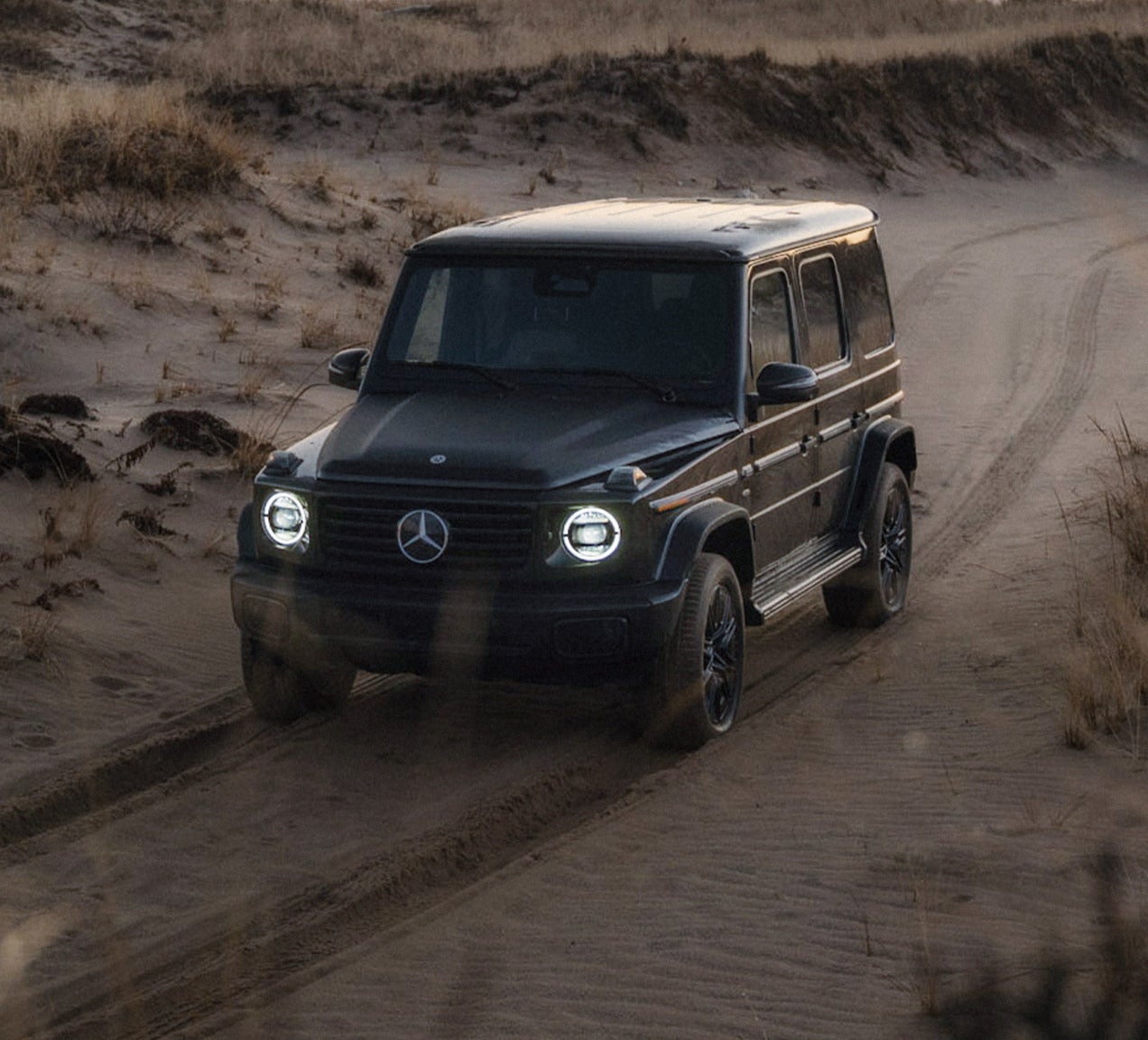 Upcoming Mini or Baby G-Wago driving on a sandy trail with rugged Mercedes-Benz styling