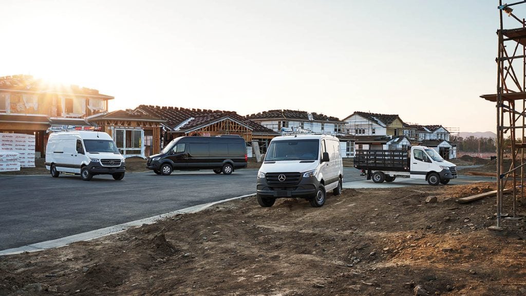Mercedes-Benz Sprinter vans lined up after winter maintenance inspection for road trips and cold conditions