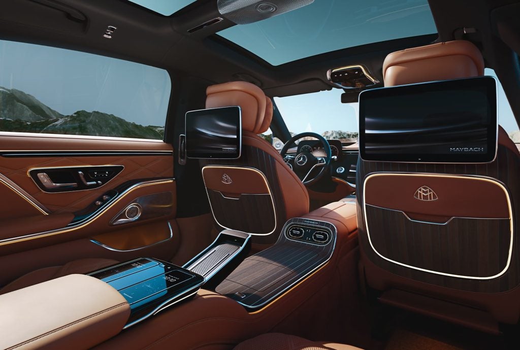 Ultra-luxury interior of the 2027 Mercedes-Maybach S-Class with brown leather and rear screens.