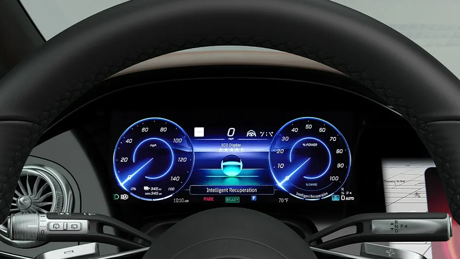 Digital instrument cluster inside the Mercedes-Benz EQS showing efficiency and intelligent recuperation features that support fuel efficiency for family SUV driving.